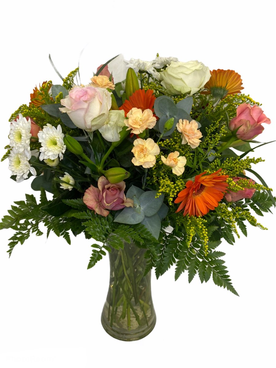 Vase of peach and cream flowers 