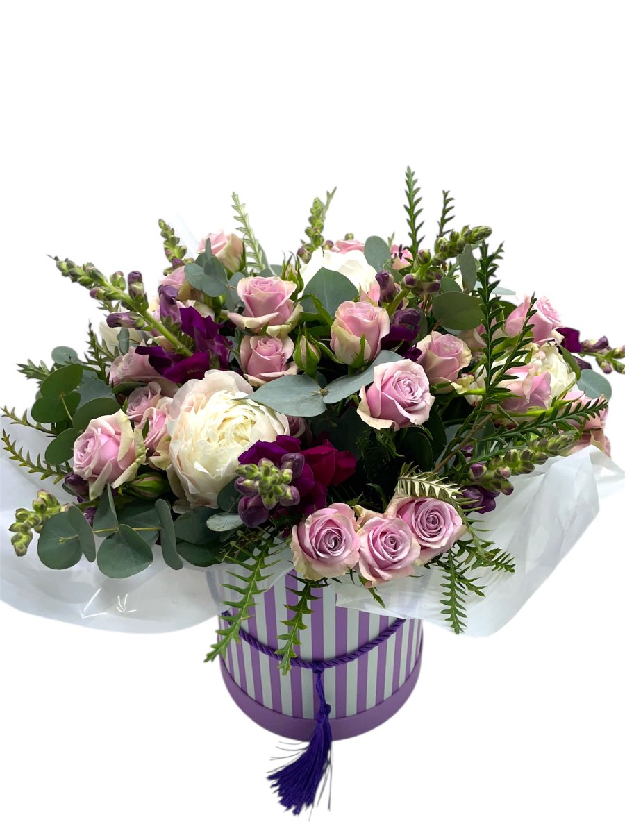 Lilac flowers in a hatbox