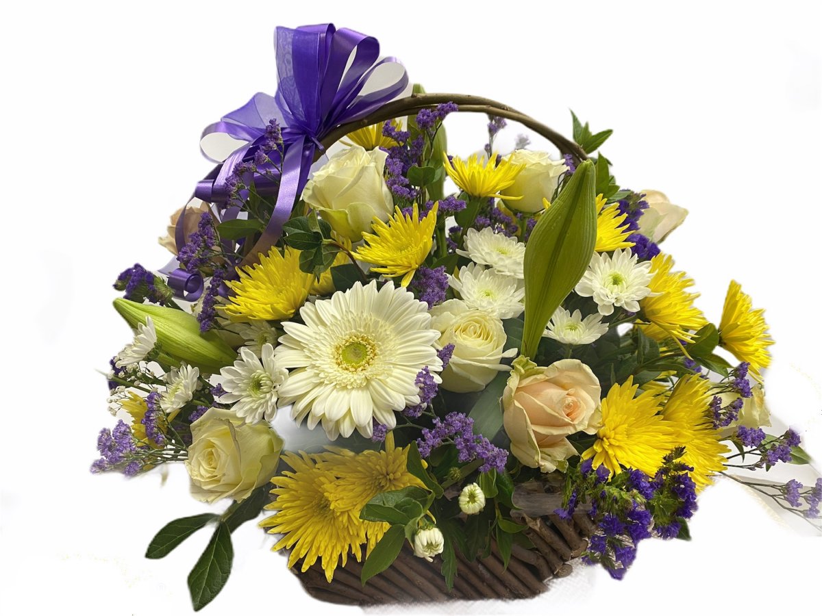 A beautiful large basket of flowers in yellow and blue colours